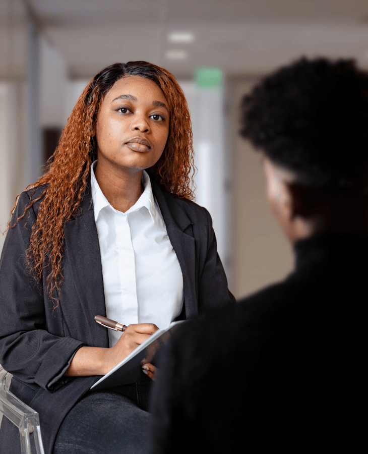 Black female psychotherapist treating a client